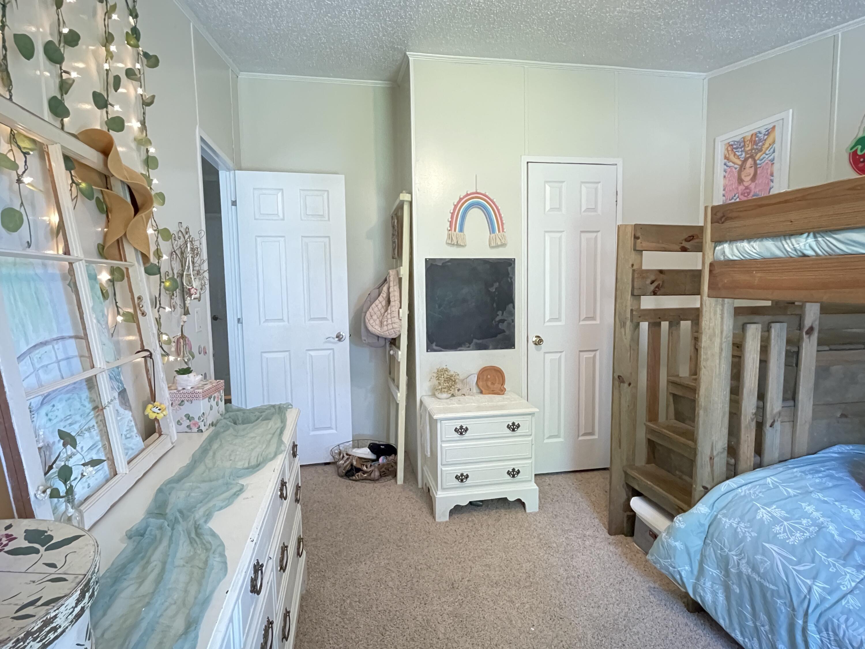2166 Healing Springs Road Blackville, SC 29817 - Photo 22 of 43 a living room with furniture and a baby crib