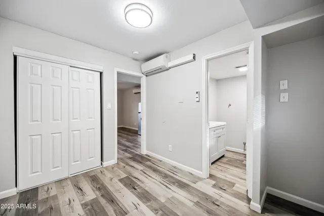 a view of a bathroom with wooden floor