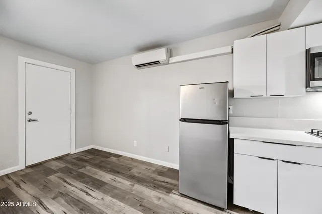 a white refrigerator freezer sitting in a kitchen