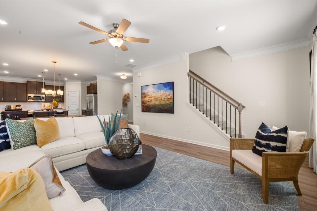 523 Grover Street Hoschton, GA 30548 - Photo 19 of 50 a living room with furniture and a ceiling fan