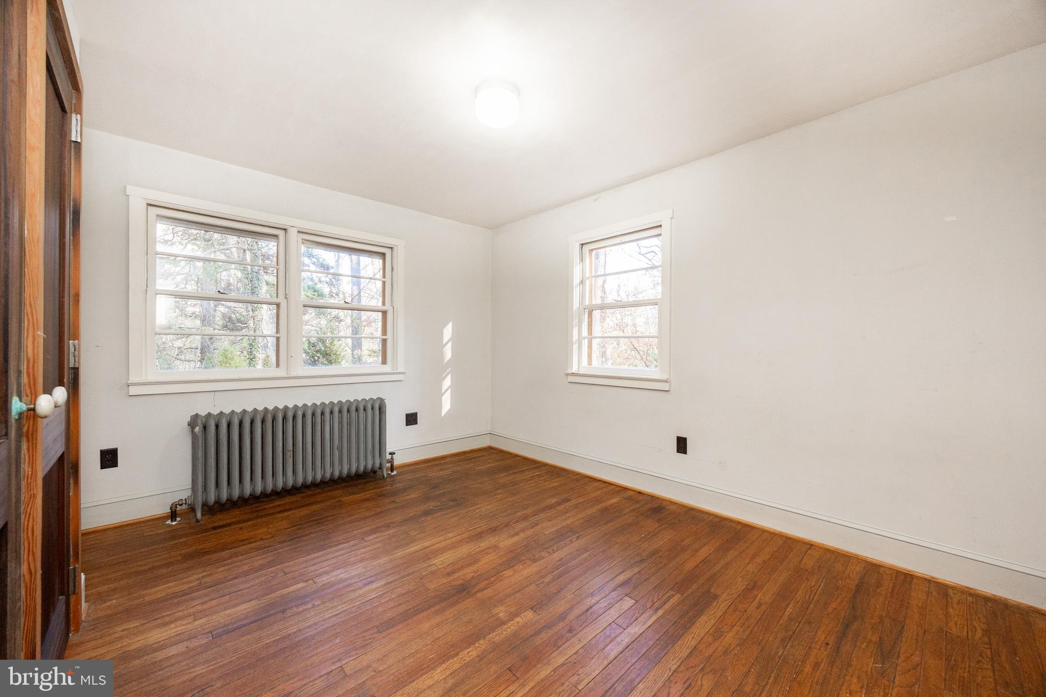 22 Bertolet School Road Spring City, PA 19475 - Photo 18 of 25 an empty room with wooden floor and windows
