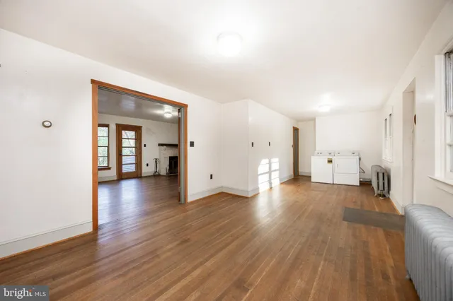 a view of a house with wooden floor and a window