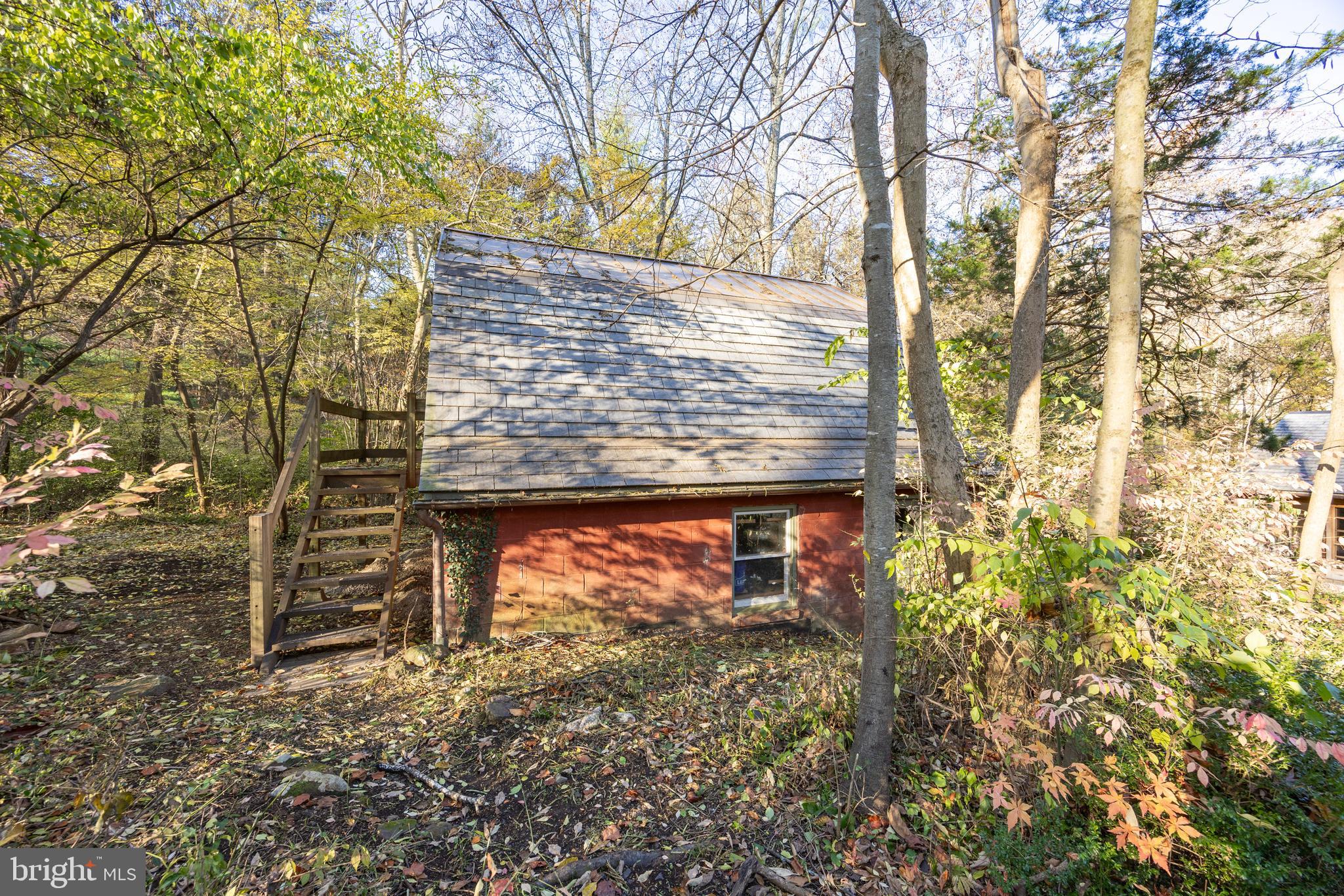 22 Bertolet School Road Spring City, PA 19475 - Photo 22 of 25 a view of a wooden door with a bench
