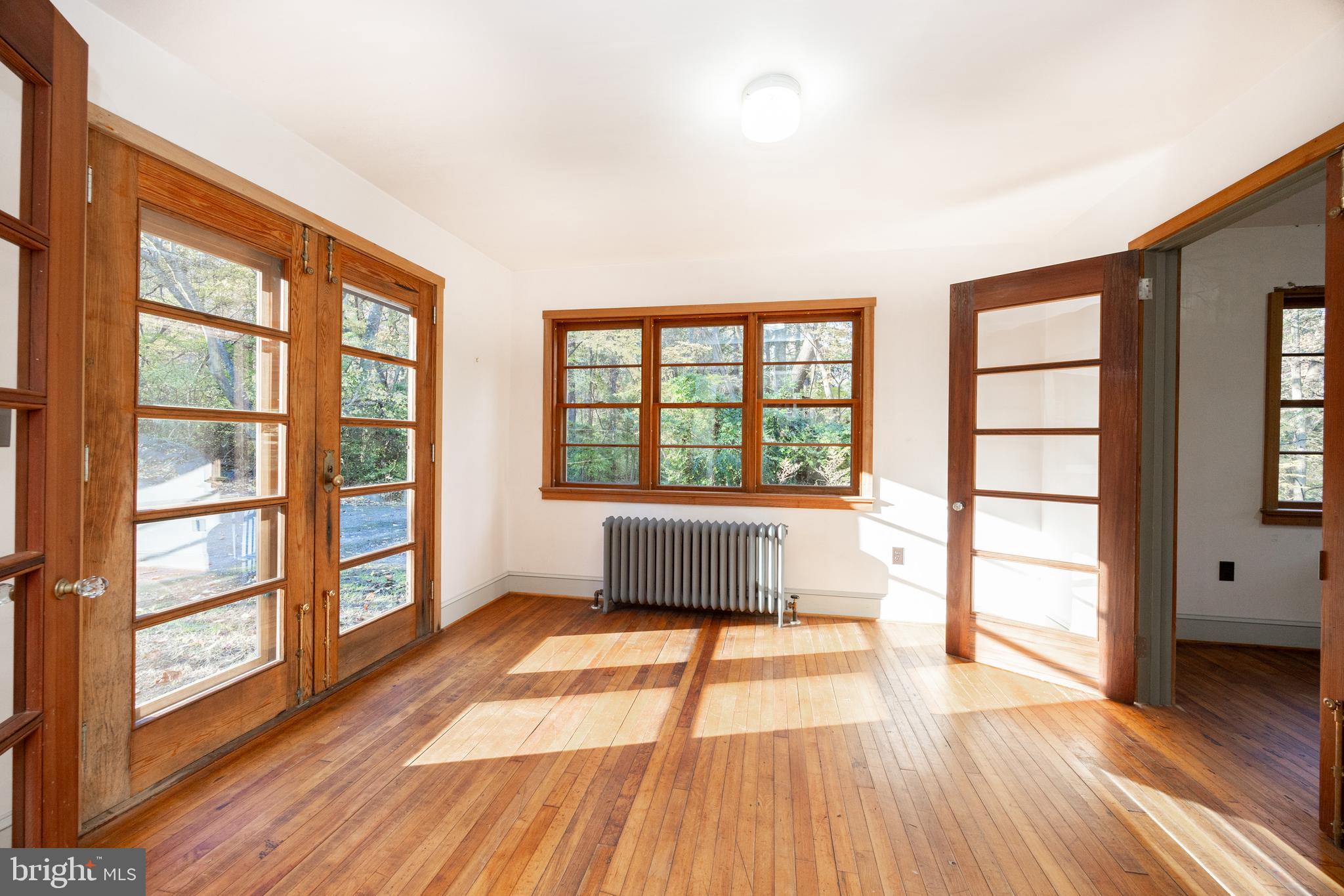 22 Bertolet School Road Spring City, PA 19475 - Photo 8 of 25 wooden floor in an empty room with a window