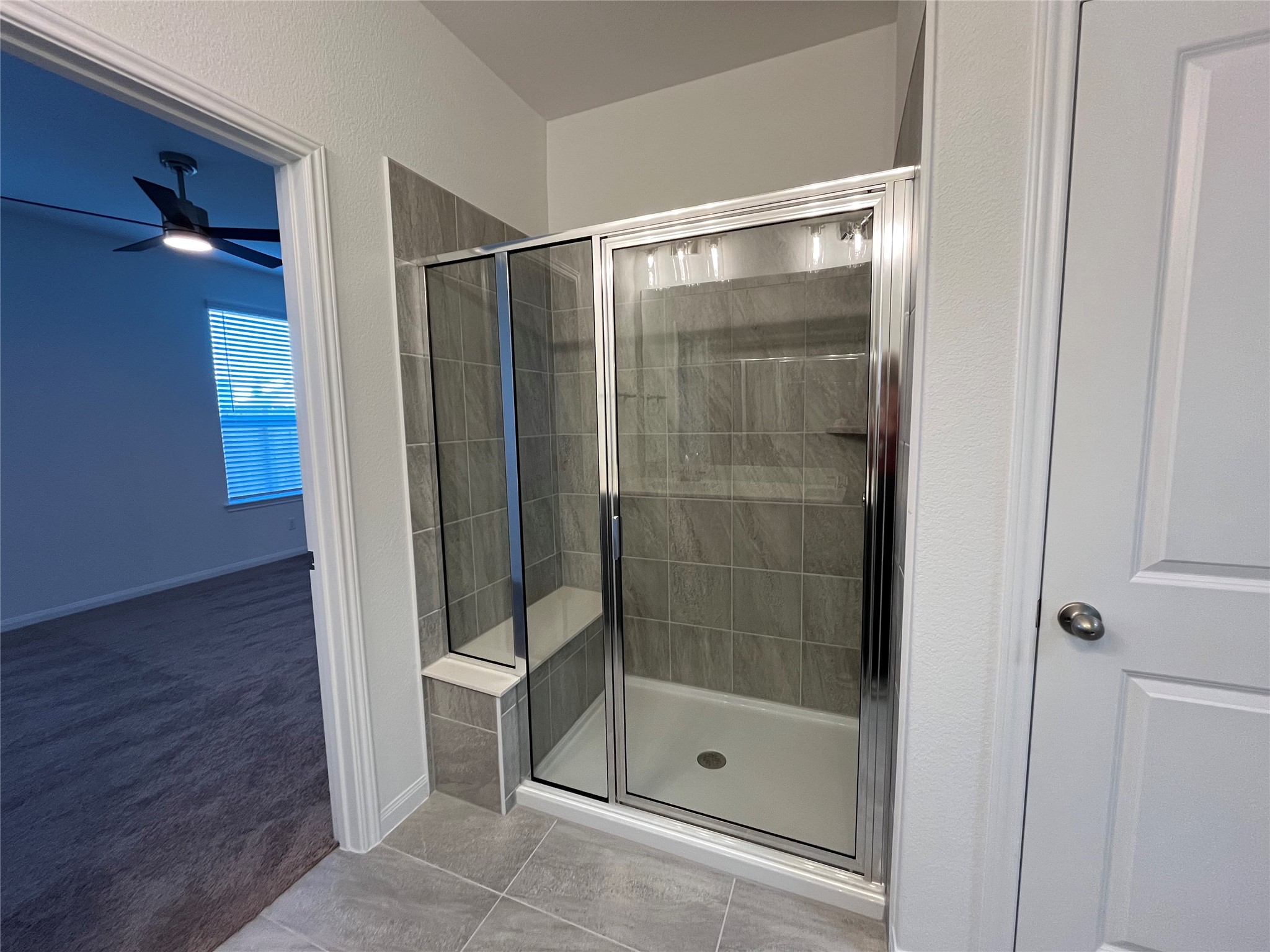 8522 Wellspring Loop Round Rock, TX 78665 - Photo 16 of 37 Large walk-in shower and bench. For demonstration purposes only. This will be the same interior layout. Colors can vary.