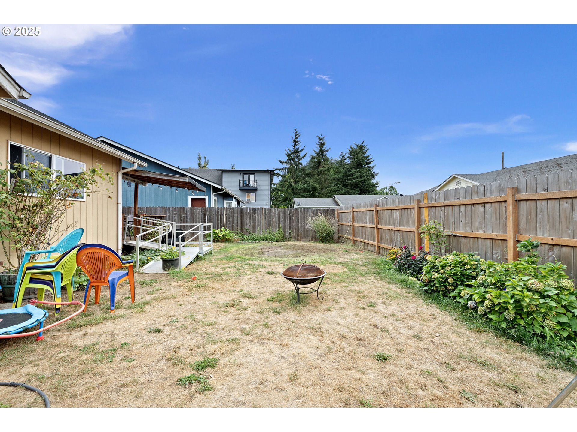 3125 V Street Springfield, OR 97477 - Photo 15 of 19 a view of backyard with swimming pool and seating space