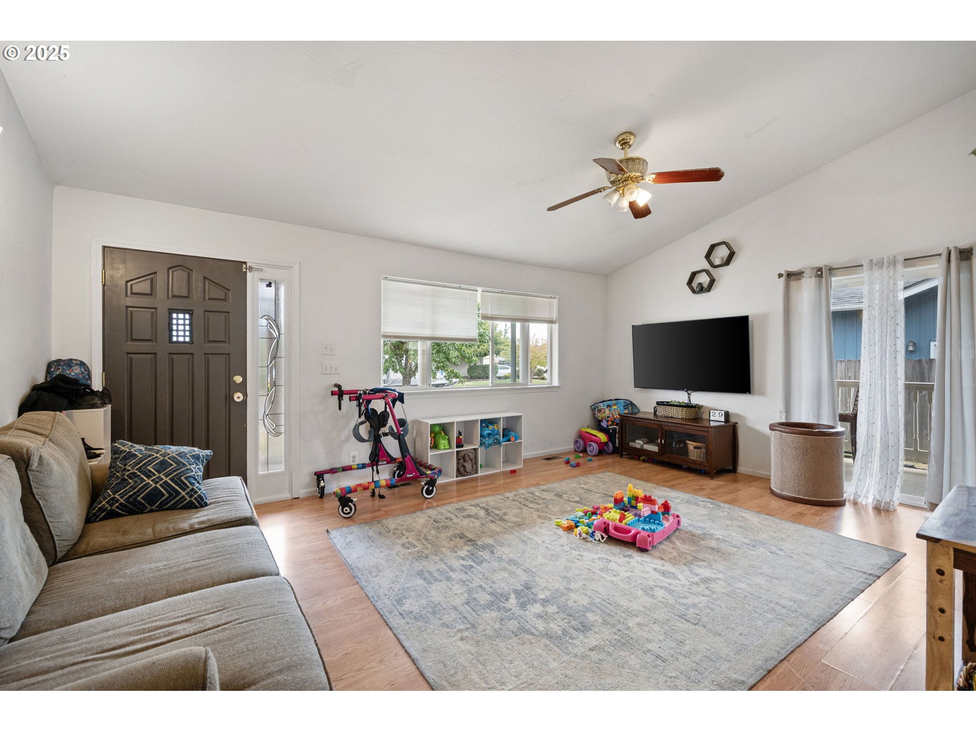 3125 V Street Springfield, OR 97477 - Photo 2 of 19 a living room with furniture and a flat screen tv