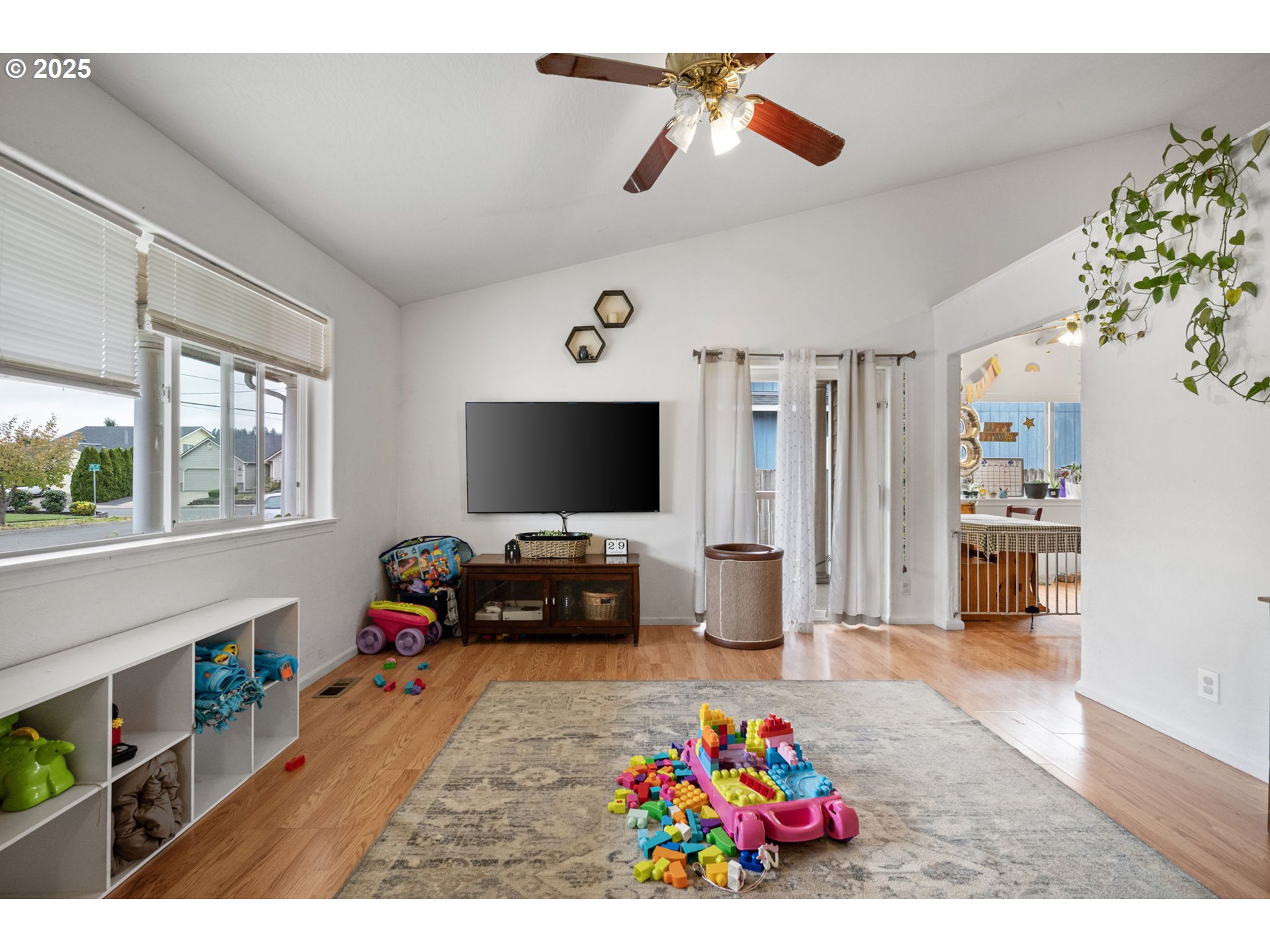 3125 V Street Springfield, OR 97477 - Photo 3 of 19 a living room with furniture and a flat screen tv