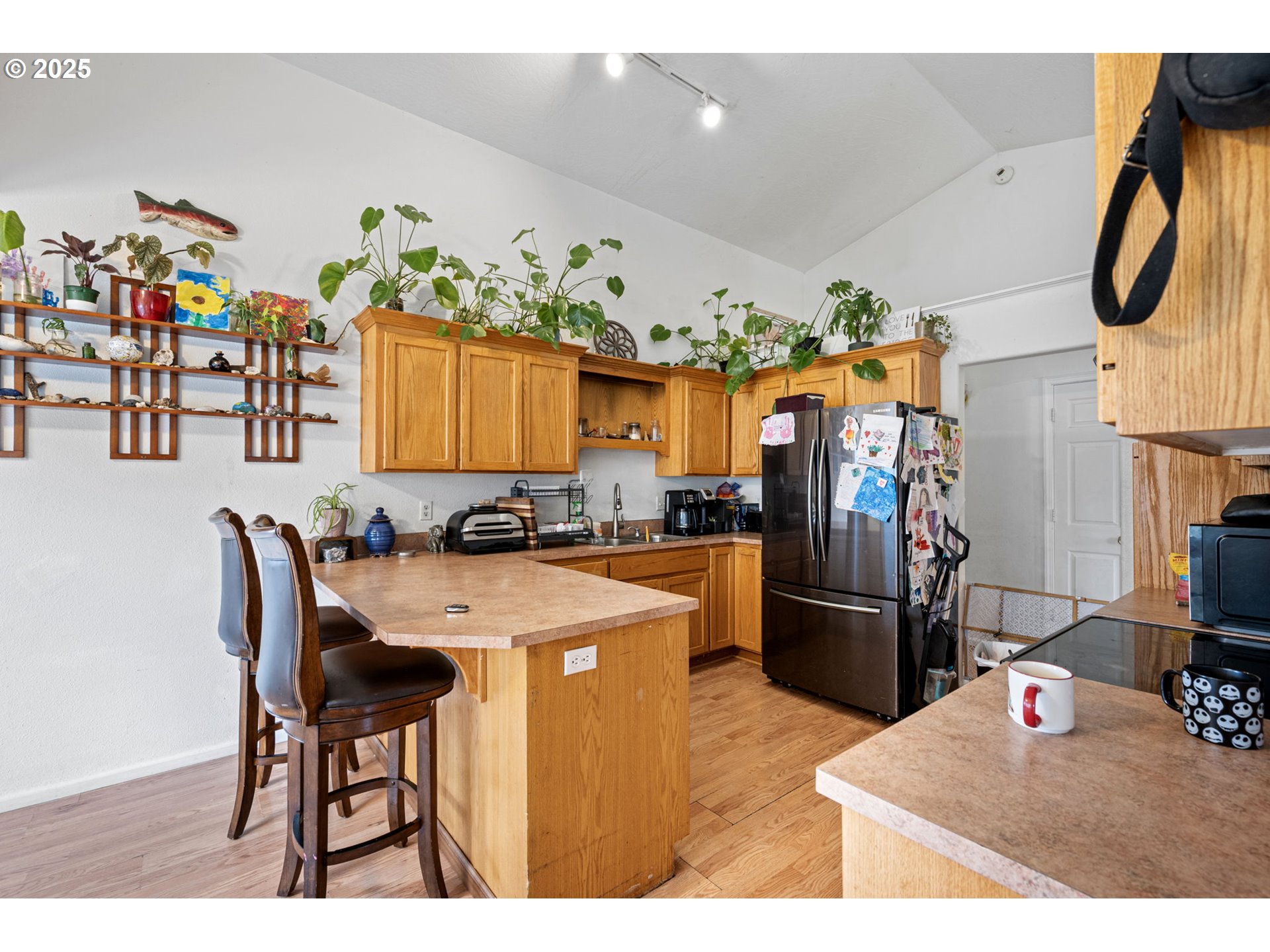 3125 V Street Springfield, OR 97477 - Photo 7 of 19 a kitchen with stainless steel appliances granite countertop a refrigerator and a sink