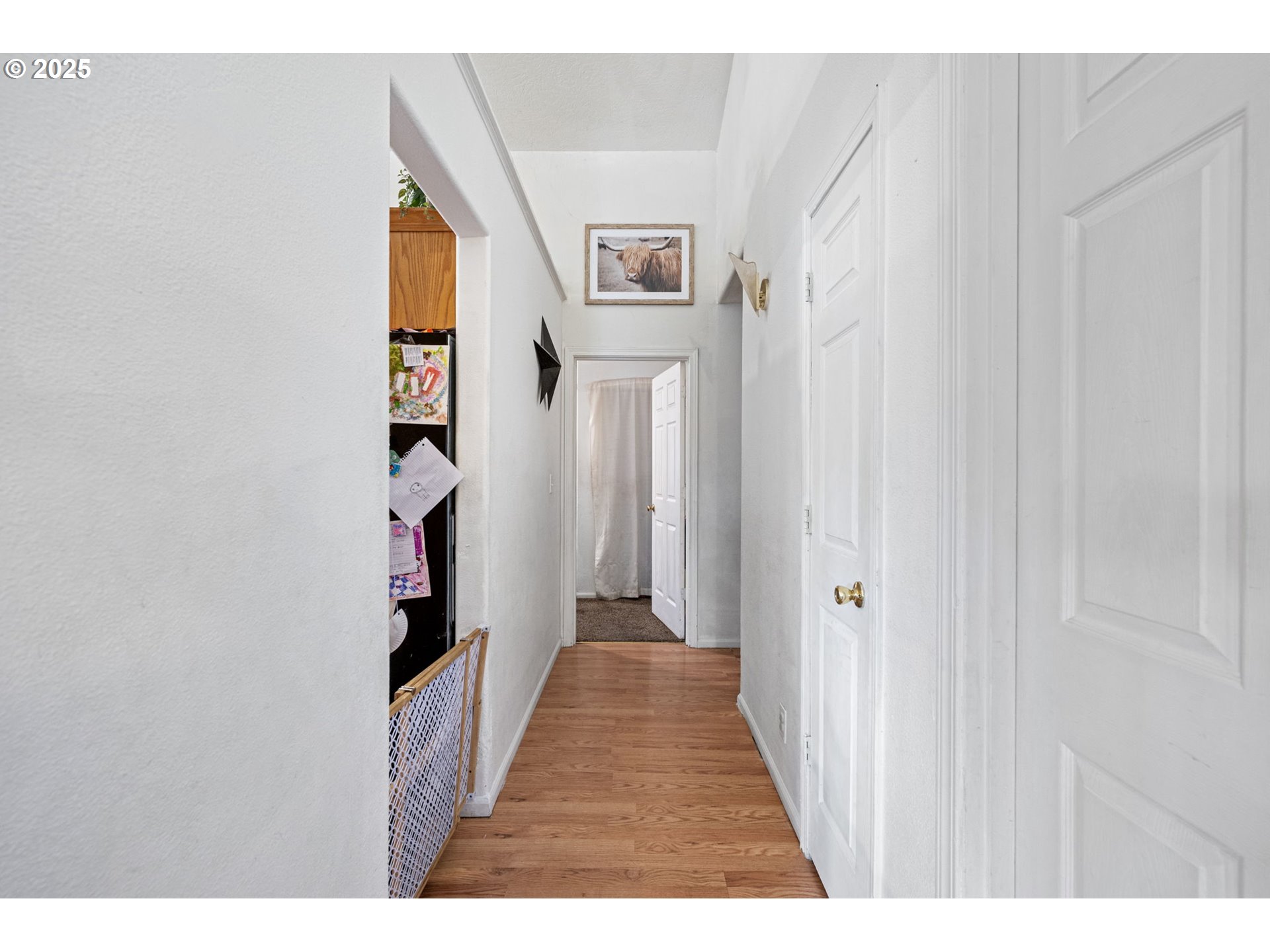 3125 V Street Springfield, OR 97477 - Photo 8 of 19 a view of a hallway with wooden floor and entryway