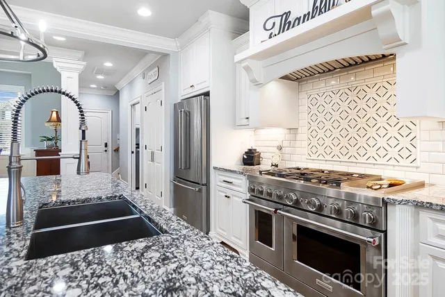 a kitchen with a stove and a refrigerator