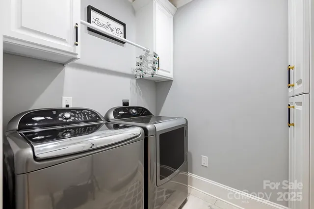 a view of storage and utility room with washer and dryer
