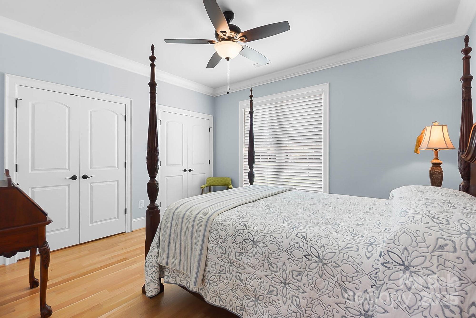 2102 Virginia Ellen Court Stanley, NC 28164 - Photo 32 of 48 a bedroom with a bed and a chandelier