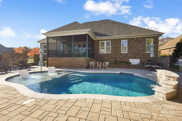 a view of a house with swimming pool