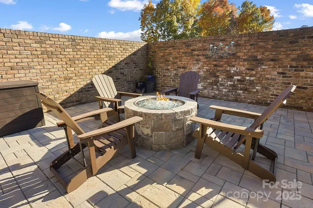 a patio with table and chairs