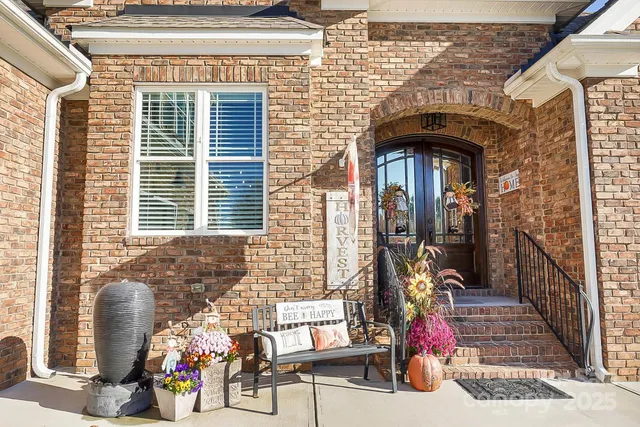 a front view of a house with outdoor seating