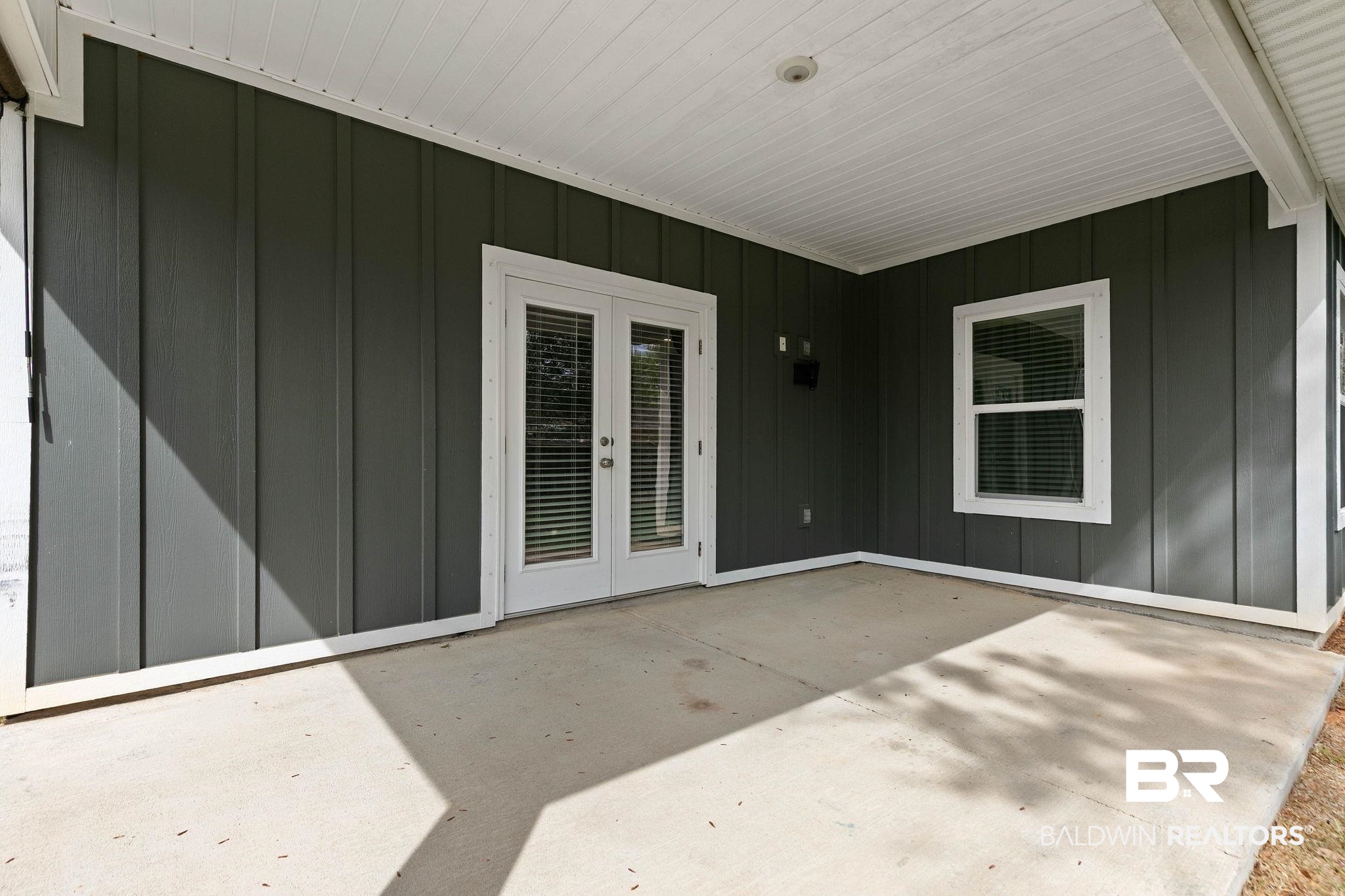 9448 Amethyst Drive Daphne, AL 36526 - Photo 59 of 61 Doorway to property featuring a patio, french doors, and board and batten siding
