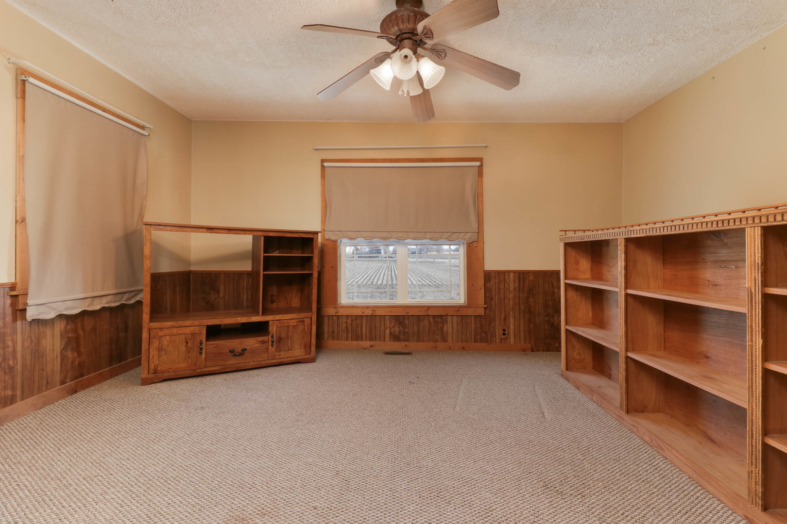 32892 McClure Road Colfax, IL 61728 - Photo 26 of 44 a view of an empty room with a window and a kitchen