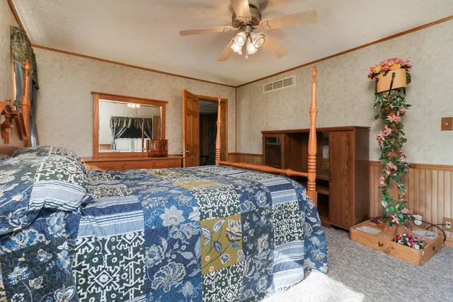 a bedroom with a bed and a couch