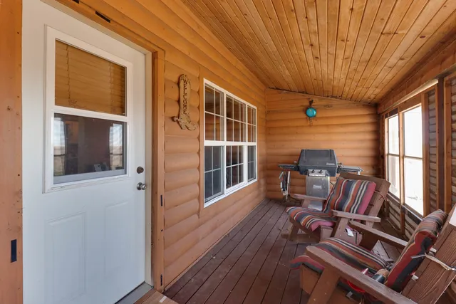 a view of living room and wooden floor