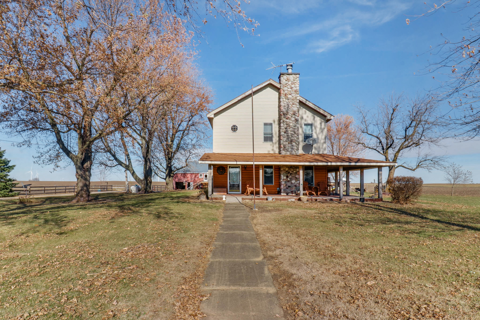 32892 McClure Road Colfax, IL 61728 - Photo 43 of 44 a view of a white house with a large tree