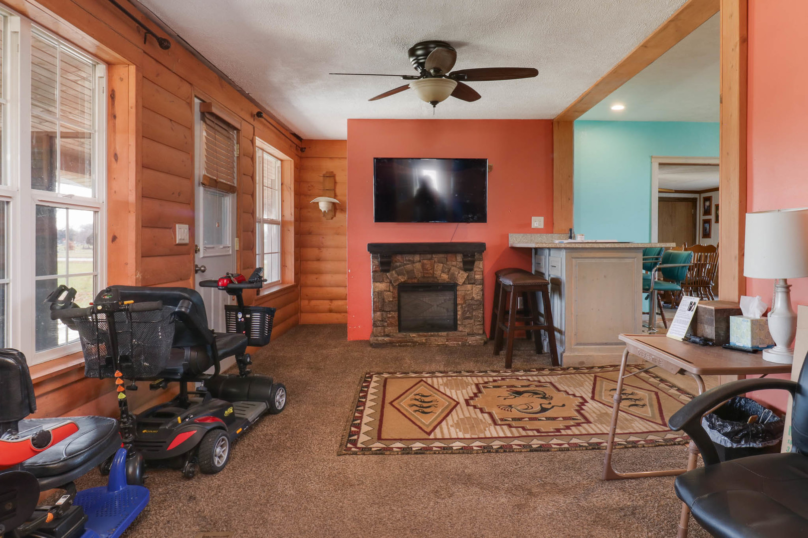 32892 McClure Road Colfax, IL 61728 - Photo 6 of 44 a living room with furniture a flat screen tv and a fireplace