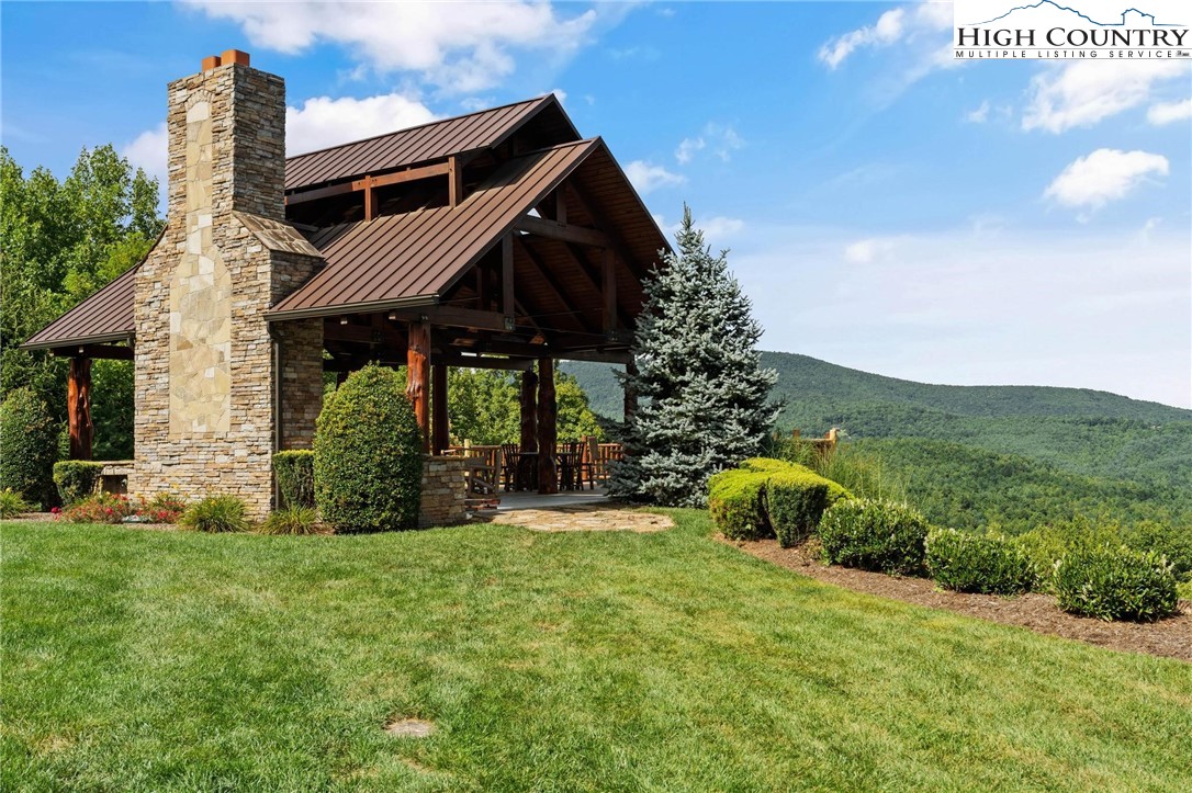 Lot 2 East Cielo Ridge Way Purlear, NC 28665 - Photo 15 of 24 a view of a house with yard and a garden