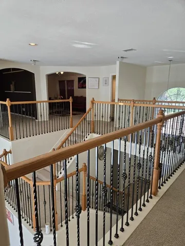 a view of staircase with lots of wooden floor and windows