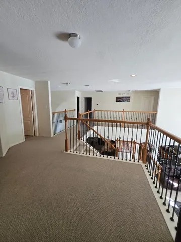 a view of a hallway with livingroom