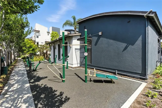 a picture of a bench in front of a wall