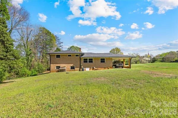 a front view of house with yard and seating