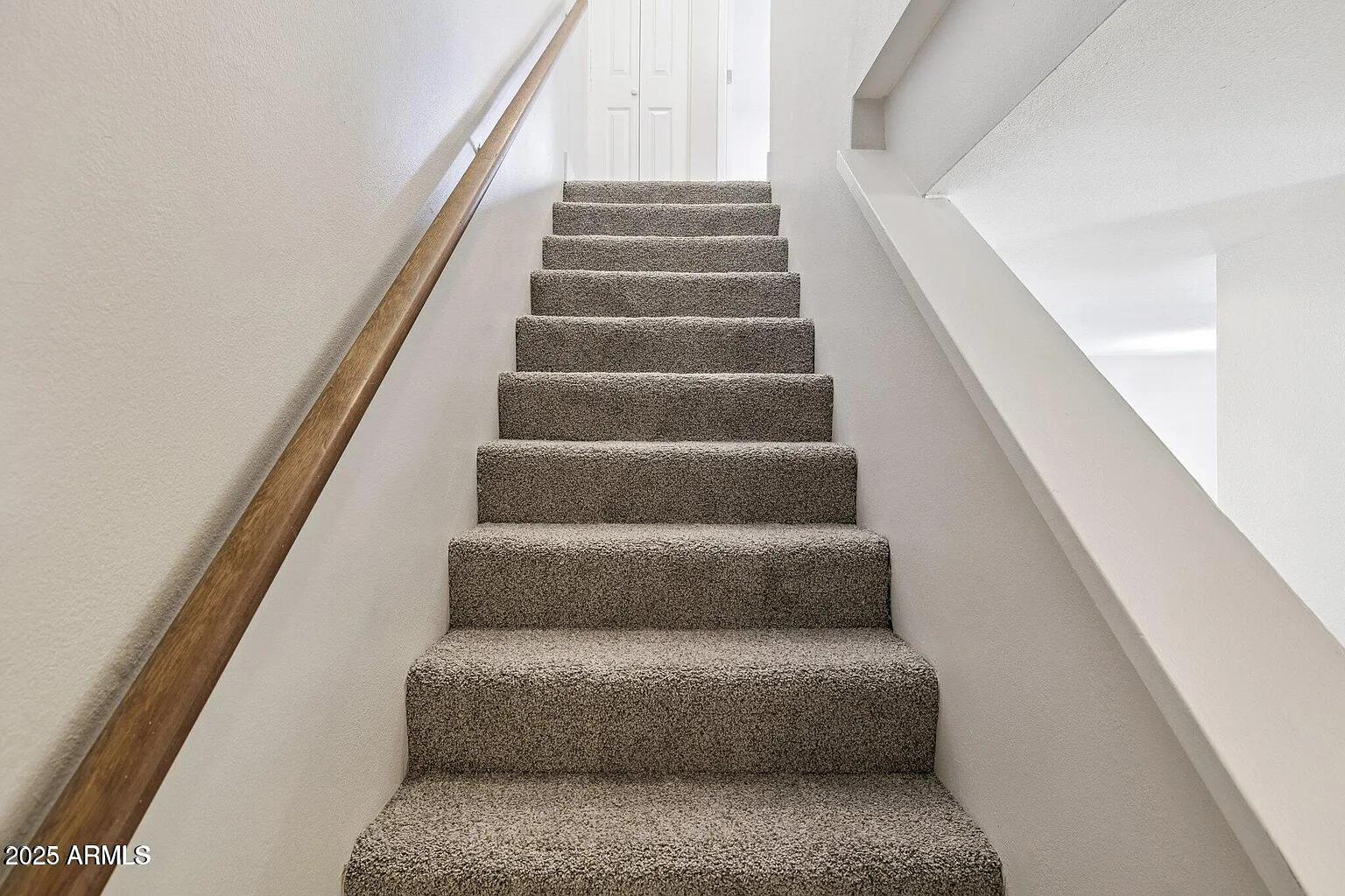 935 North Granite Reef Road, Unit 100 Scottsdale, AZ 85257 - Photo 12 of 29 a view of staircase with white walls