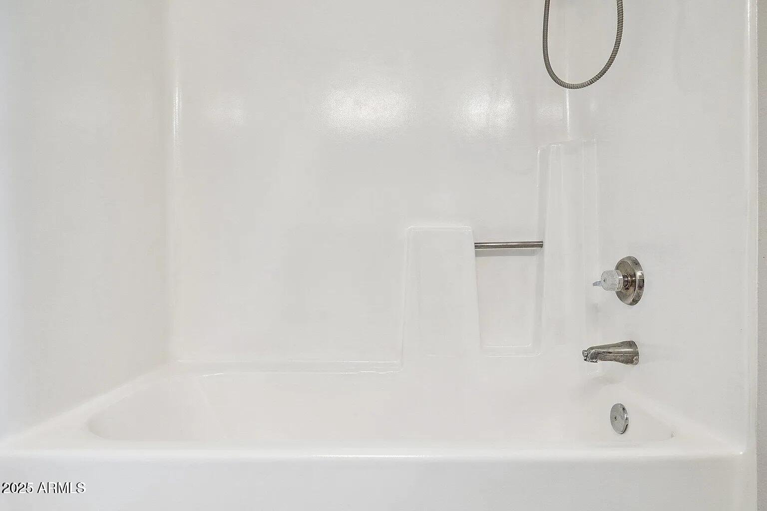 935 North Granite Reef Road, Unit 100 Scottsdale, AZ 85257 - Photo 17 of 29 a bathroom with a bath tub with a shower