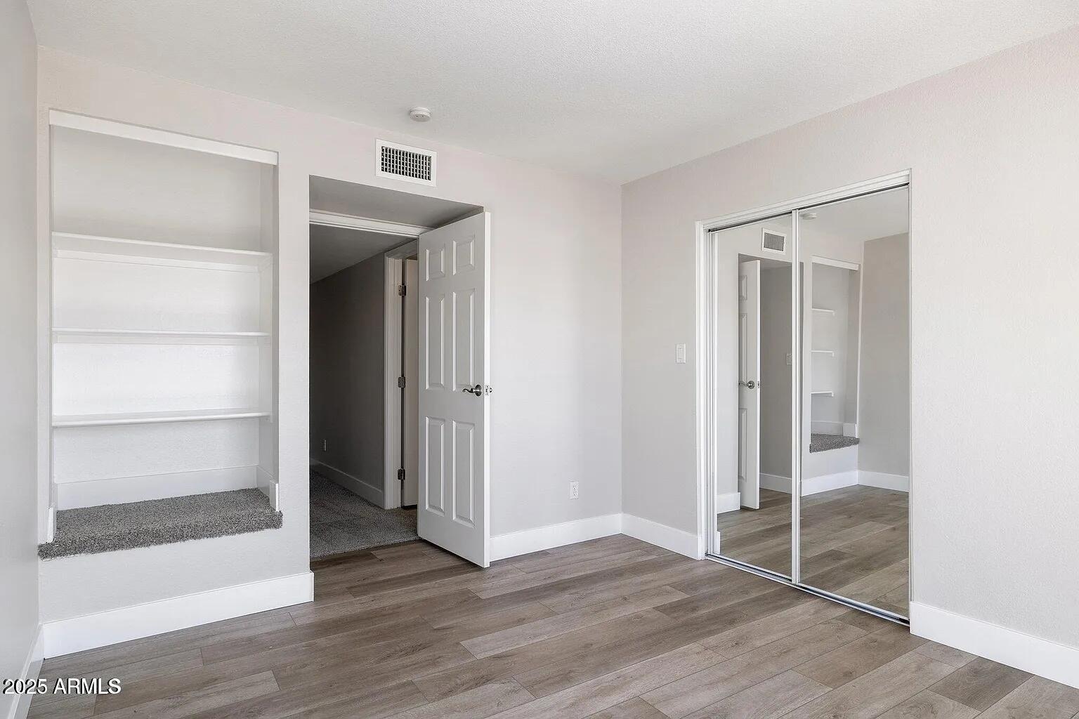 935 North Granite Reef Road, Unit 100 Scottsdale, AZ 85257 - Photo 20 of 29 a view of wooden floor and closet in a room