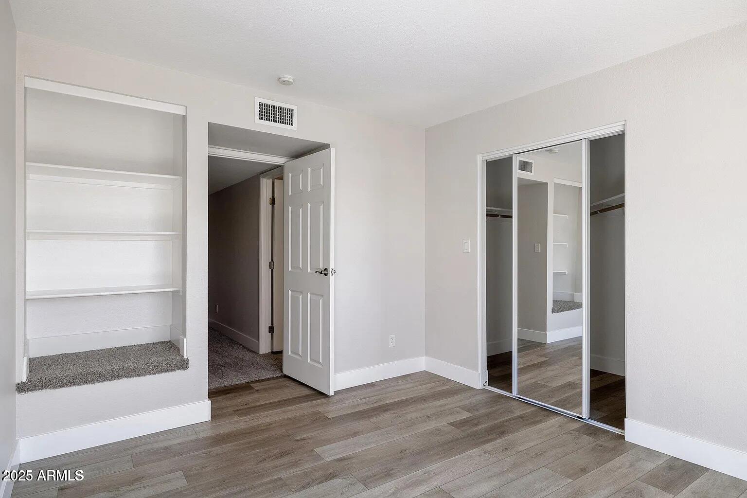 935 North Granite Reef Road, Unit 100 Scottsdale, AZ 85257 - Photo 22 of 29 a view of empty room with wooden floor