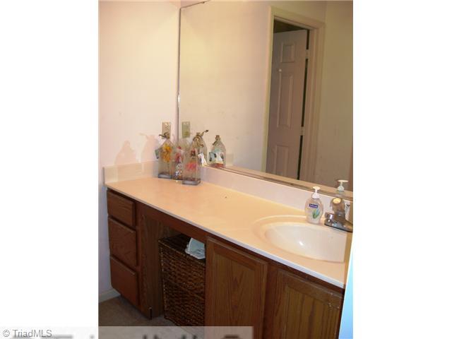 5615 Horse Farm Road Summerfield, NC 27358 - Photo 11 of 15 Master Bath/Spa. Dressing area with sink and vanity