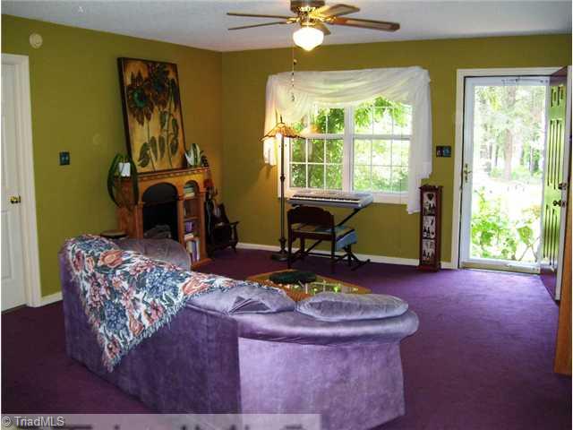 5615 Horse Farm Road Summerfield, NC 27358 - Photo 4 of 15 Den/Family/Great Room. An open design allows for easy entertaining and enjoyment. Dual window and a full view glass storm door allows for views of the front yard.