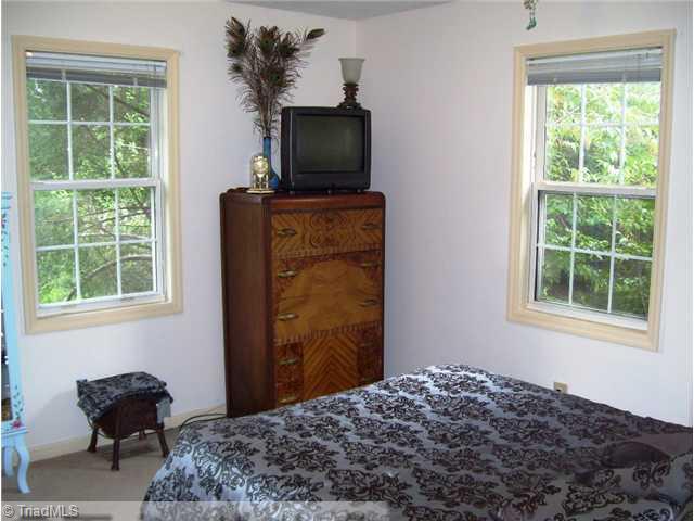 5615 Horse Farm Road Summerfield, NC 27358 - Photo 8 of 15 2nd Bedroom. One of three bedrooms has neutral carpeting. This bedroom is freshly painted!