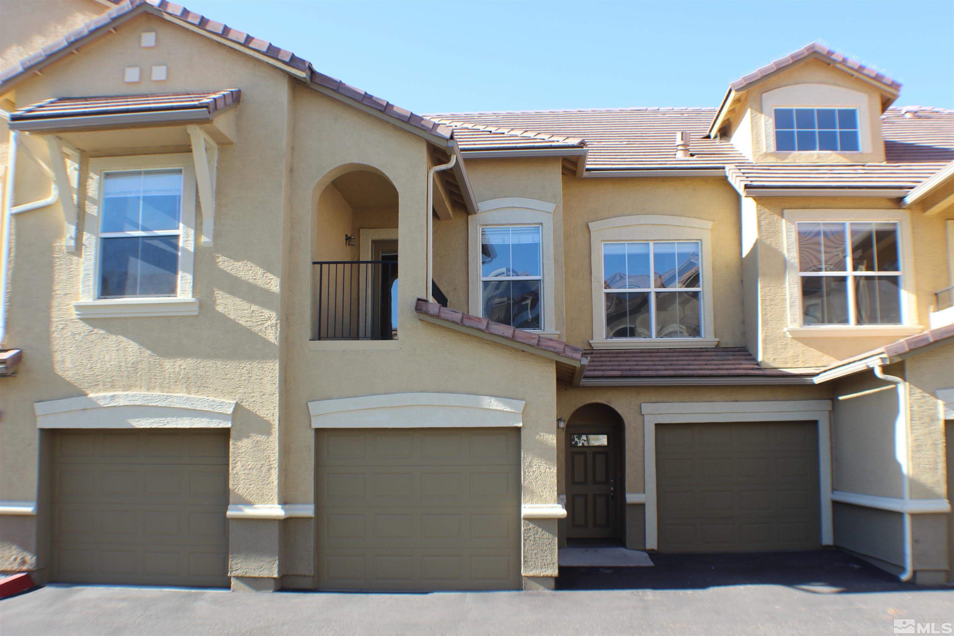 9050 Double R Boulevard, Unit 422 Reno, NV 89521 - Photo 1 of 33 a front view of a house with a balcony