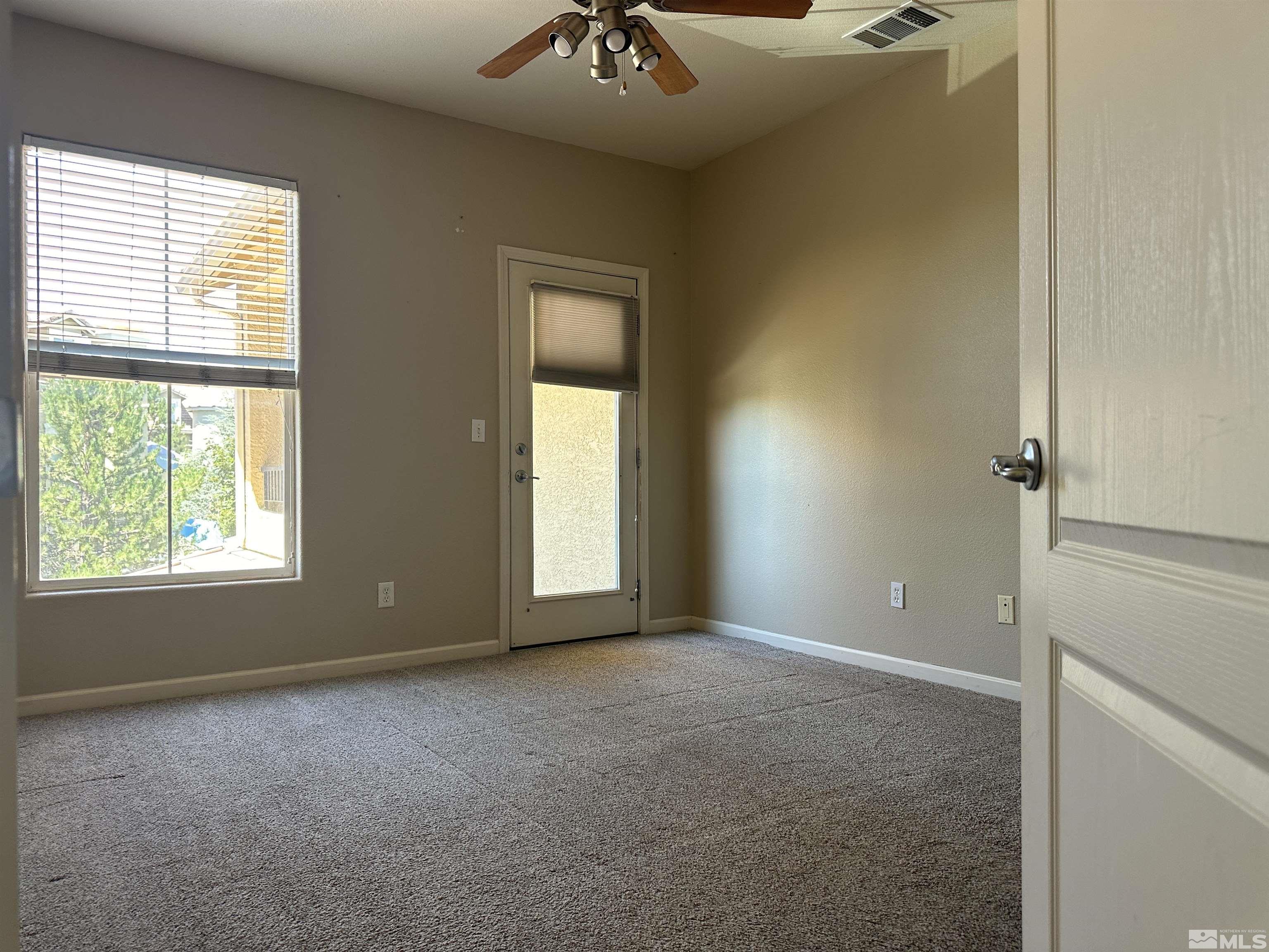 9050 Double R Boulevard, Unit 422 Reno, NV 89521 - Photo 13 of 33 a view of an empty room with a window