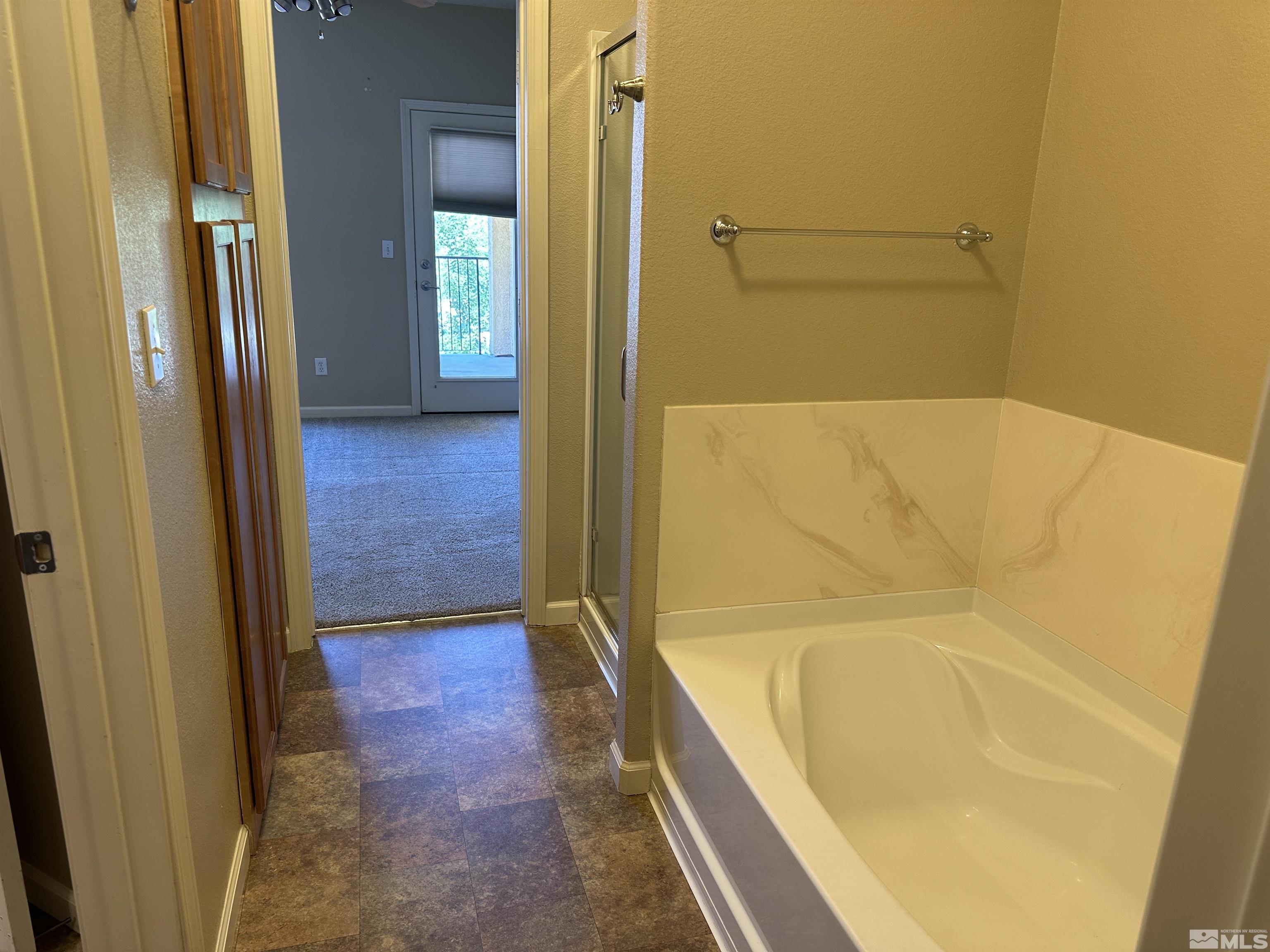 9050 Double R Boulevard, Unit 422 Reno, NV 89521 - Photo 18 of 33 a bathroom with a tub
