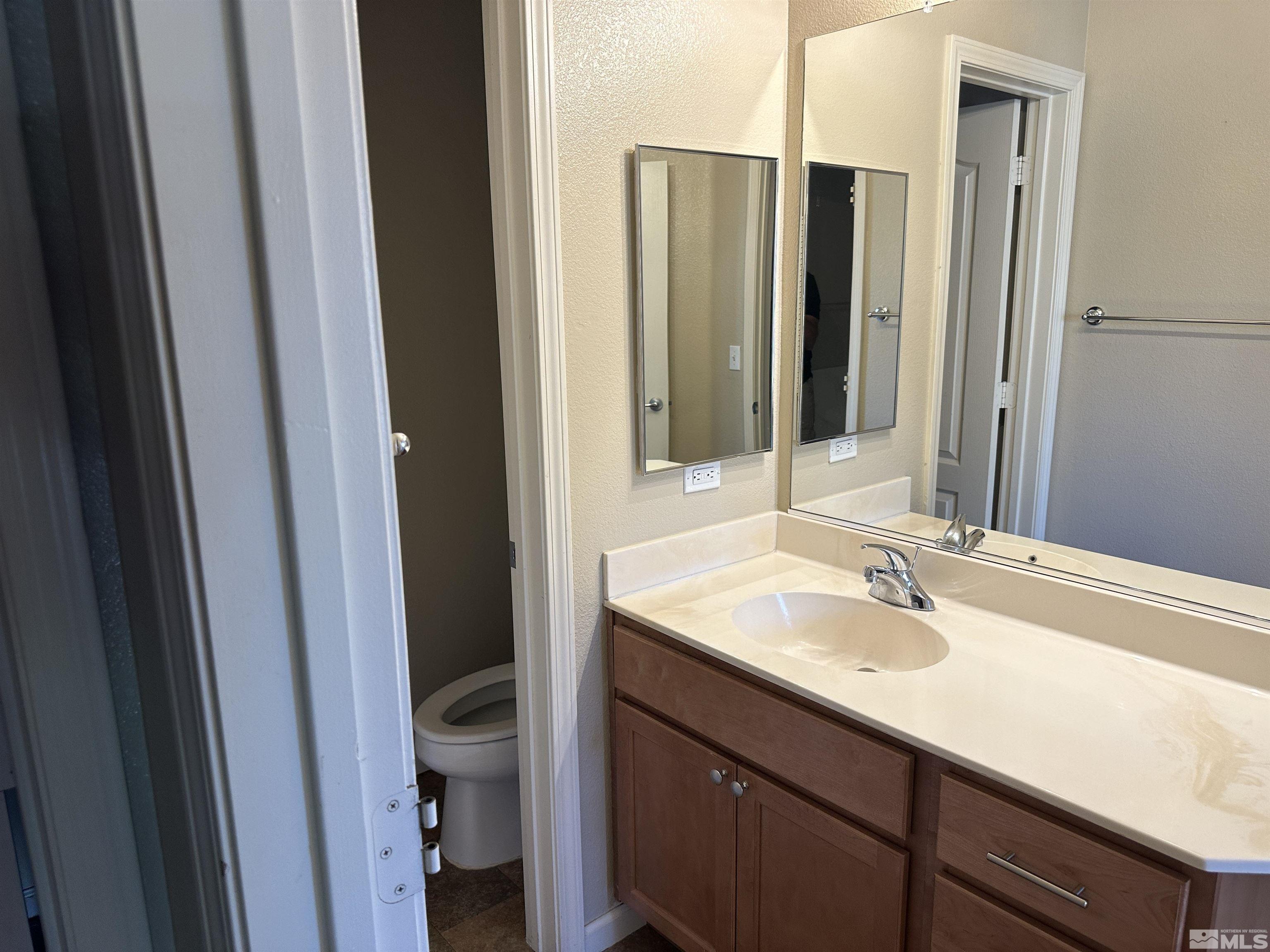 9050 Double R Boulevard, Unit 422 Reno, NV 89521 - Photo 21 of 33 a bathroom with a sink and a mirror