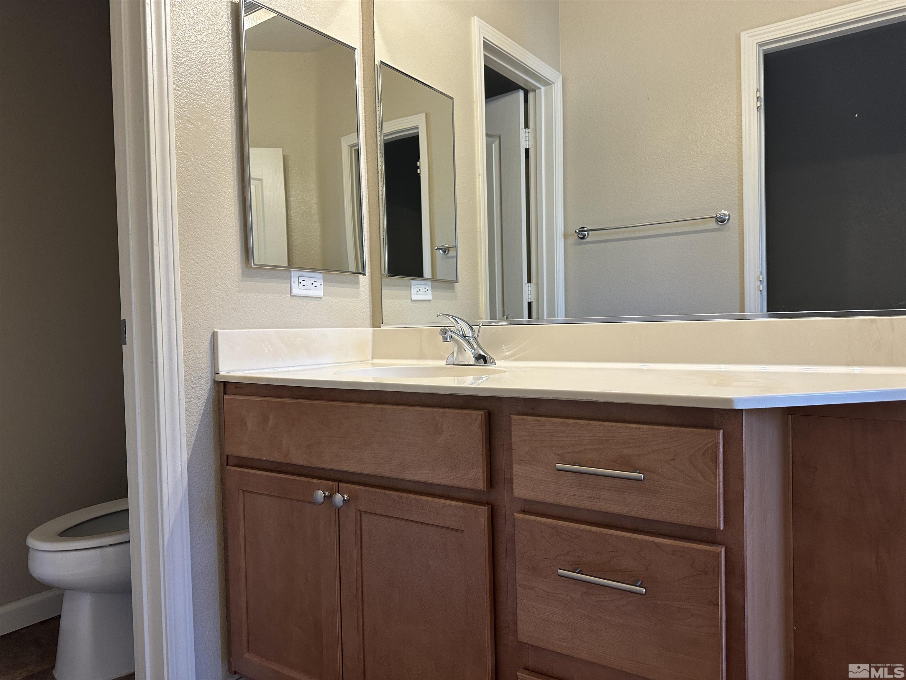 9050 Double R Boulevard, Unit 422 Reno, NV 89521 - Photo 22 of 33 a bathroom with a sink and a mirror
