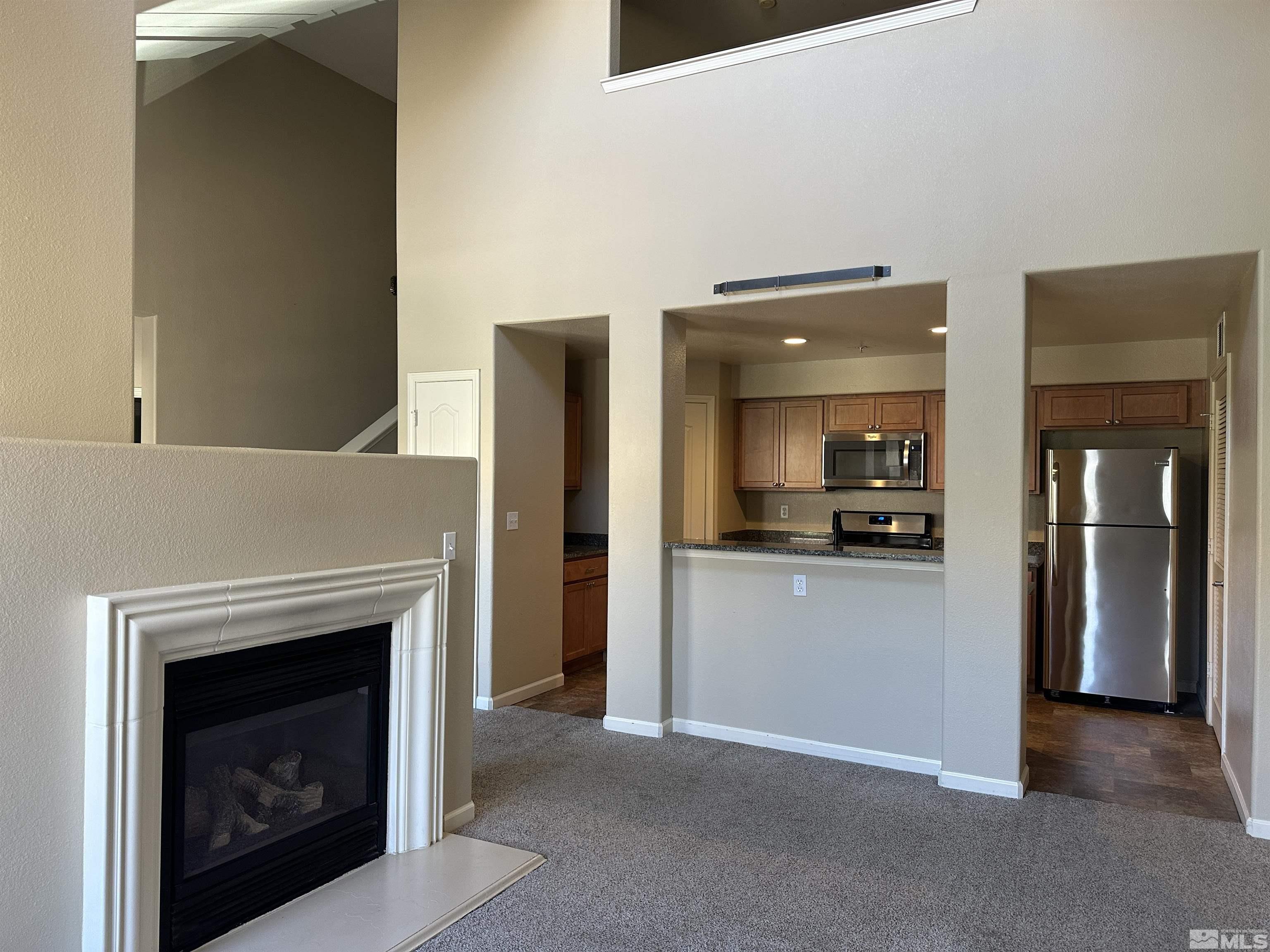 9050 Double R Boulevard, Unit 422 Reno, NV 89521 - Photo 3 of 33 a view of a livingroom with a fireplace