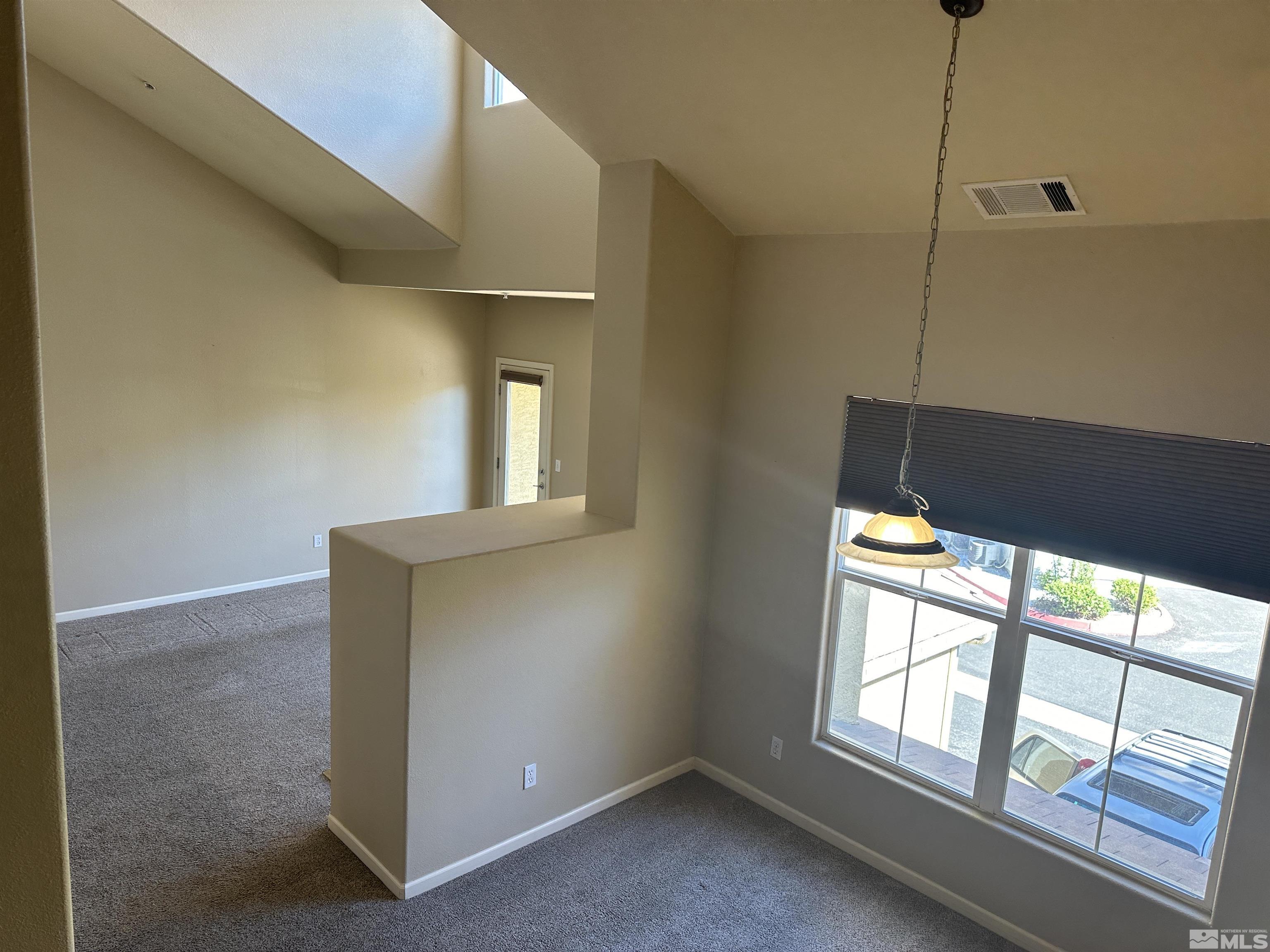 9050 Double R Boulevard, Unit 422 Reno, NV 89521 - Photo 5 of 33 a view of empty room with windows