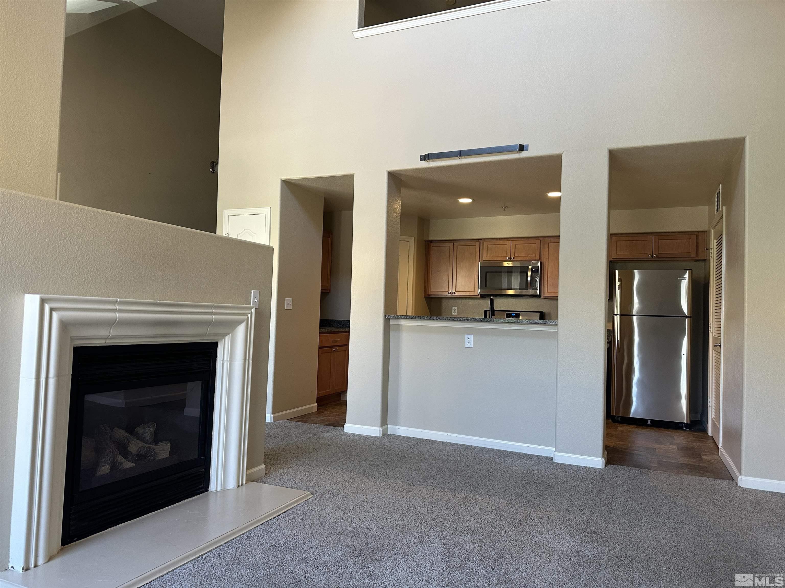 9050 Double R Boulevard, Unit 422 Reno, NV 89521 - Photo 8 of 33 a view of a livingroom with a fireplace