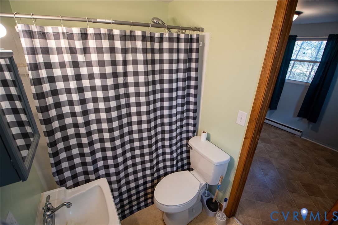 11750 Bevils Bridge Road Amelia Court House, VA 23002 - Photo 12 of 15 Full bath featuring baseboard heating and a shower