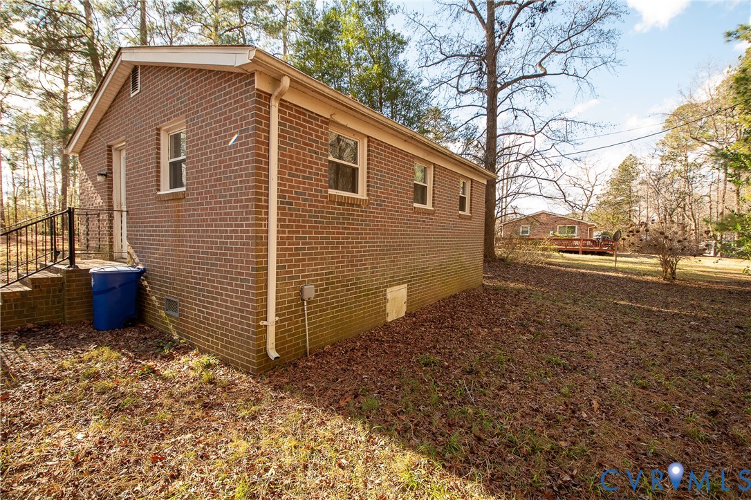 11750 Bevils Bridge Road Amelia Court House, VA 23002 - Photo 3 of 15 View of side of home with crawl space and brick si