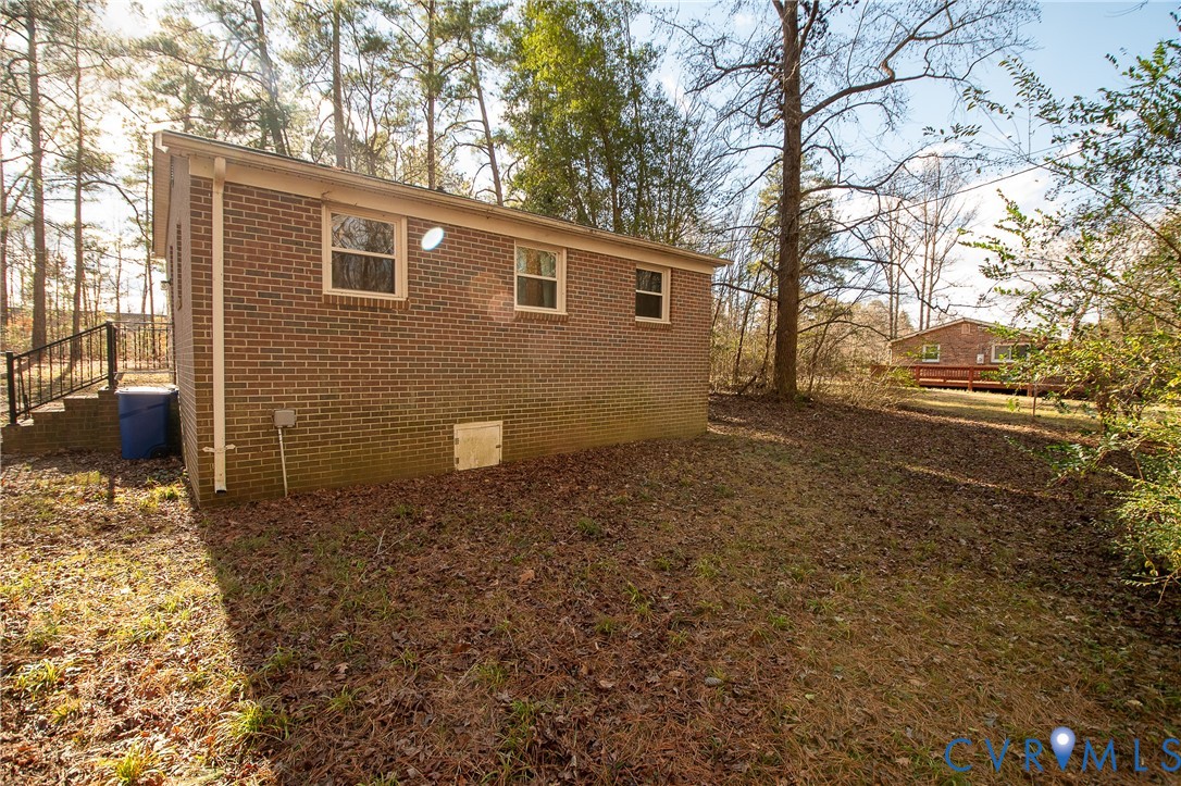 11750 Bevils Bridge Road Amelia Court House, VA 23002 - Photo 4 of 15 View of home's exterior featuring crawl space, bri