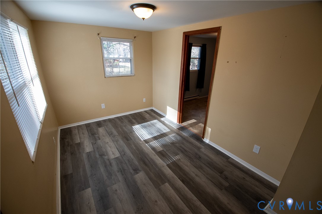 11750 Bevils Bridge Road Amelia Court House, VA 23002 - Photo 8 of 15 Unfurnished room with dark wood-style floors and b